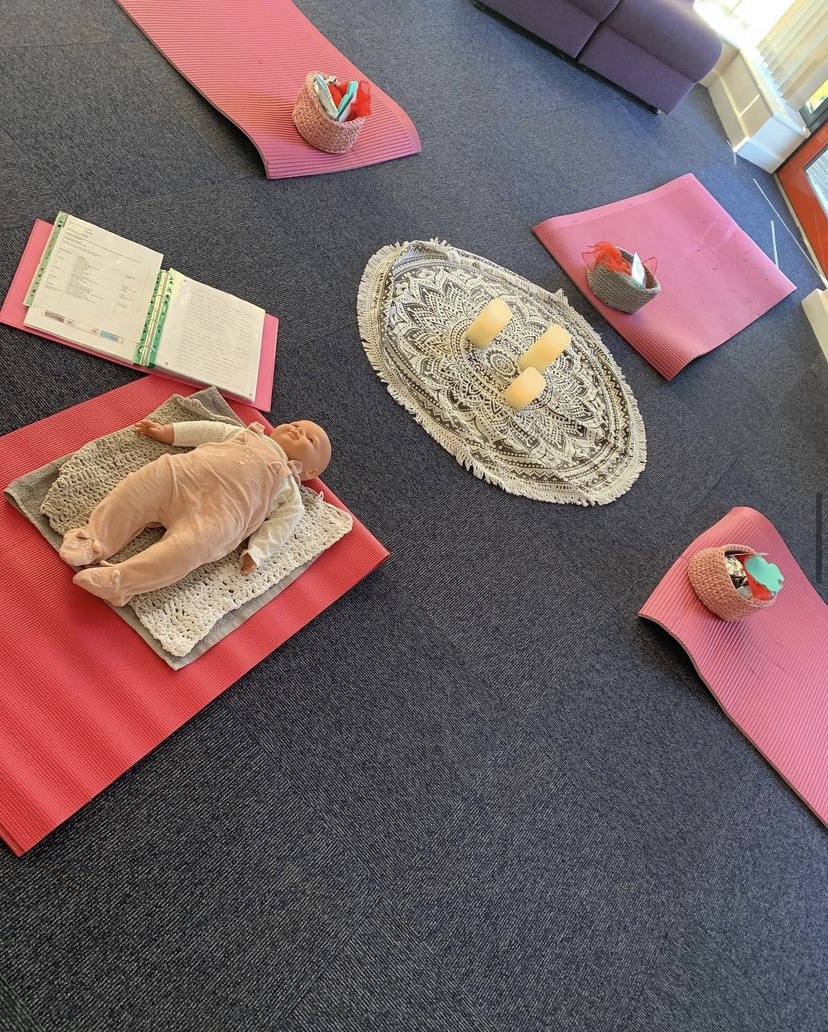 A photo showing yoga mats and the setup of the class