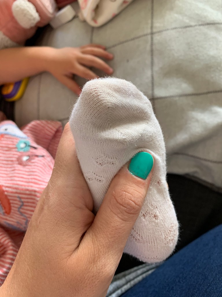 A picture of me massaging a baby foot